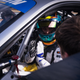 Cook behind the wheel, explaining what’s going on with the car.
